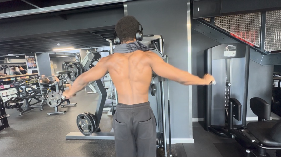Josh performing a cable fly in the gym